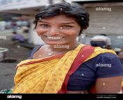 a smiling member of indias hijra eunuch transsexual community dressed in a sari in mumbai india 2tbwy93.jpg from local hijras in mumbai