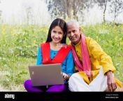 rural villager grandfather and teen girl using laptop e learning in farm mmdj7h.jpg from desi old uncle young lady sex