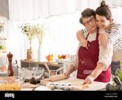 young happy woman hugging her grandma cooking in a kitchen mtbfaf.jpg from my grandparents sex in kitchen