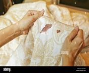 women hold bed sheet with period blood spot stains on blur background m2n3a9.jpg from chutt blood