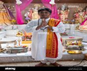 posed portrait of a teenage pandit at a youth service at the milan mandir hindu temple in south ozone park queens new york pah7nc.jpg from pandit