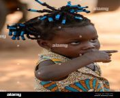 pira benin jan 12 2017 unidentified beninese little girl with braids in colored clothes points her finger benin children suffer of poverty due t pgm1pd.jpg from benin vano baby azetogbèdé de benin