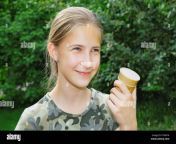 a cute 13 year old girl with ice cream in her hand walking in summer park the joy of the holidays p1nr1m.jpg from 13 yr old se