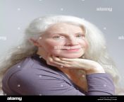 portrait of an attractive mature woman with beautiful long white hair in front of gray background rjdy95.jpg from granny white hairy