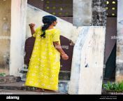 puduchery india december circa 2018 unidentified young and elegant woman in indian yellow sari on the streets of village india woman posing in rpxpaw.jpg from aunty dgge style