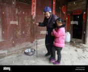 5 year old chinese girl wang anna helps her great grandmother to go to toilet at home in zhuyuan village zhima town zunyi city southwest chinas gu w7yetb.jpg from chinese go to toilet