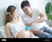 pregnant couple of husband and wife feels love and relax at home young expecting holds baby in pregnant belly father take care of pregnant mother c w6x1h8.jpg from www pregnant sex com্রামের বà