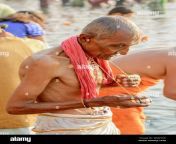 an elderly indian hindu man wearing a lungi performs an early morning bathing ritual in the river ganges varanasi uttar pradesh india south asia w8mykk.jpg from indian old man dhoti bath nude penis