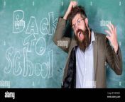 teacher or educator stands near chalkboard with inscription back to school hate school teacher unhappy shouting hysterically face man refuses begin work at school teacher goes mad about schooling wb1mg1.jpg from à¤²à¤¡à¤à¤à¥à¤¤ school teacher sex video