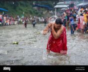a women takes a holy bath during the ritualsnepalese perform rituals to honor fathers who passed on at the bank of the bagmati river during kuse aunse or fathers day a religious ritual and worship for departed souls and prayers of eternal peace wed473.jpg from nepali women open holy river bath