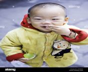 china shanghai young chinese boy toddler in a bright yellow and red a5kb4h.jpg from chines small and yong