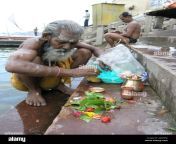old indian man making an offering to the ganges varanasi in indian amyb58.jpg from indian desi old man doing sex