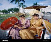 women dressed in traditional malay costume in trishaw penang malaysia an2fy1.jpg from one malay