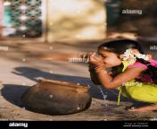 indian girl drinking fresh water from a clay pot at a rural indian arwjmk.jpg from indian drinking andrea village h