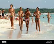 four young semi nude women walking along the beach spain balearen b8rngc.jpg from family beach nudist