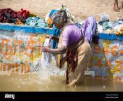 woman washing clothes in a river tamil nadu india bhm5g2.jpg from tamil aunty washing clothes in riverside hot sexy video
