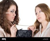 two beautiful girls and one handbag isolated bt83x9.jpg from india handsmother