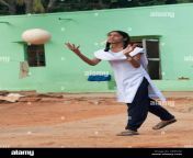 young indian school girl throwing a ball in a rural indian village cb3cg6.jpg from desi village school