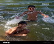 young indian boys bathing in the waters of lake pichola udaipur rajasthan cbp977.jpg from young and antuy bathing