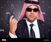 arab hit man holding gun on black background d8mtnj.jpg from arab gu