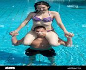 couple having fun in the water at public swimming pool she is sitting ddacjn.jpg from couple having fun in public train