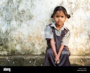 rural indian village school girl sitting against a wall at school dkaxj3.jpg from indian village school gill