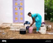 indian woman washing clothes outside her home in a rural indian village dhjccx.jpg from aunty washing public desi sitting pussy him