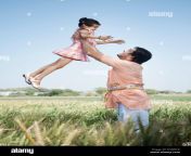 farmer carrying his daughter in the field sohna haryana india d3weck.jpg from farmer father in sex daughter