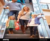 mother and children on escalator in shopping mall e6yxw6.jpg from mall mom son