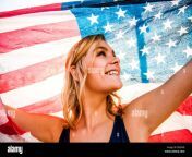caucasian teenage girl holding american flag eb3ekb.jpg from teenage american