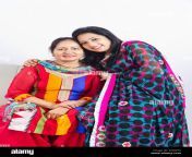 2 indian adults only mother and daughter sitting sofa eh8w54.jpg from indian adults photo
