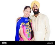 2 indian punjabi married couple standing pose ewxcbb.jpg from punjabi sikh lovers