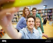 students with smartphone taking selfie in library eyebdy.jpg from library me selfie