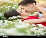 happy young couple kissing in park fx9w2e.jpg from lovers smooching in park