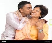 portrait of happy indian family at home indian 30s grown son kissing f1mbfd.jpg from indian old mummy san kiss sex