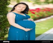 portrait of happy young pregnant chinese woman in the park g61e0j.jpg from chinese preg