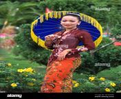 a young malaysian woman dressed in traditional costume with colorful gc3awm.jpg from malay