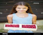 beautiful brunette little girl holding a box with a raspberry summer gmc3b7.jpg from litle tenns