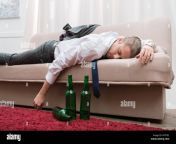drunk man sleeping on a sofa in the living room kp579c.jpg from drunk sleeping