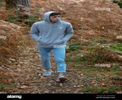 18 year old teenage boy walking in the woods on an autumn day kw7tw4.jpg from 18 old teenage
