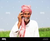 1 indian rural farmer old man talking cell phone field kxdcge.jpg from old indian guy using mobile cam in ba