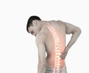 a man with visible spine holds his back.jpg from back p