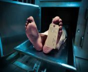 feet of body in morgue tray with label on toe.jpg from dead