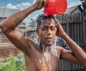 man with bucket shower dhaka bangladesh 1200x853.jpg from bathing with