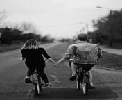 couple biking holding hands couple holding hands on bicycle.jpg from husband wife fasnight xxxandem bike