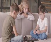 videoblocks older sister and two younger brothers playing chess sitting on the couch at home siblings spending time indoors happy family carefree childhood intelligent game racm0x4hb thumbnail 1080 01.png from older sister younger brother sex