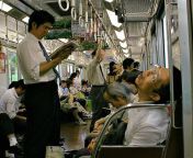 packed train in japan with snoring salaryman.jpg from japanese work